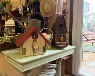 Vintage birdhouses and garden items.