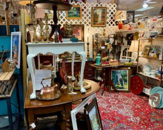 Lots of framed, original signed oils, rugs, vintage tables and kitchenware.