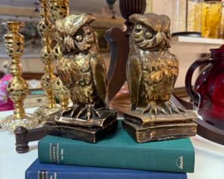 Vintage intricately carved brass candlesticks, interesting 70s owl bookends.