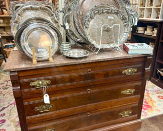 Pretty silver platters, vintage dresser.