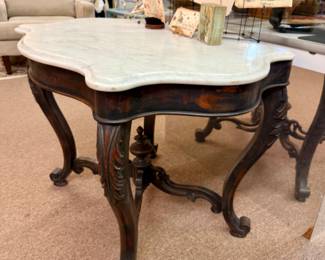 Beautiful marble topped table, solid wood carved wood base.