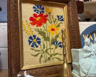 Vintage needlepoint, tiny dog figures and brass bells.