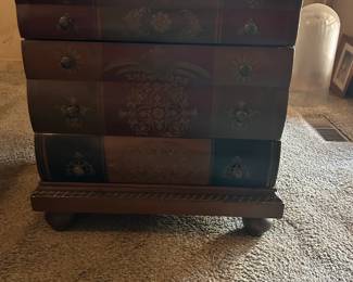 Book inspired cabinet with embossed details