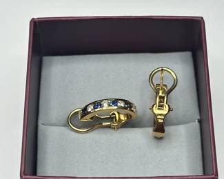 J36 - $1,750. Tiffany & Co. 750. 18kt gold, Diamond & Sapphire Huggie earrings with Omega back. When on has a .75" drop. In excellent condition!