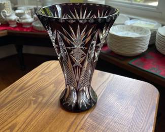 W128 - $35. Cranberry cut to clear crystal vase. Measures 8.25" tall.