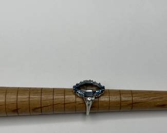 J3 - $500. Size 5.5. 14kt gold. (Aquamarine or Blue Topaz Stone.) Missing one small diamond.