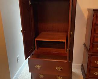 W23 - $85. Small Armoire. 2 drawers slide easily. Measures 30" wide x 23" deep x 62" tall. Top is meant for a small TV - does not have hanging bar. Doors DO slide inside.