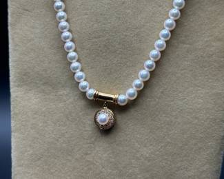 J37 - $1,500. Mikimoto Pearls. Authenticated. 17.5" long necklace. 18kt gold clasp and pendant. Pearls are 4-4.5mm. 