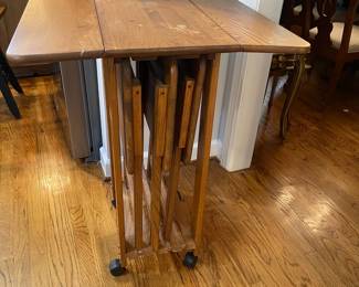 W119 - $50. Folding TV Tables (3) and drop leaf stand on wheels. Water marks on table top (pictured)