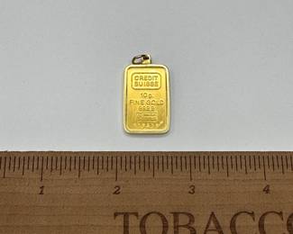 J18 - $1200. 10 grams of fine gold .999 from Credit Suisse in a 14kt charm surround.