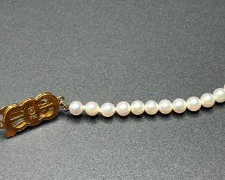 J37 - $1,500. Mikimoto Pearls. Authenticated. 17.5" long necklace. 18kt gold clasp and pendant. Pearls are 4-4.5mm. 