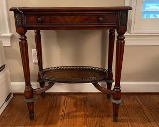W58 - $225. Four Corner Imports "Crotch Veneer Side Table" from Whitley Furniture Galleries. Measures 27" wide x 16" deep x 30" tall. Gently used in formal living area! Wood with Metal Accents. Single Drawer.