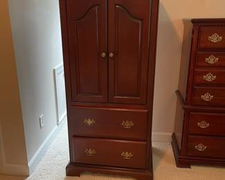 W23 - $85. Small Armoire. 2 drawers slide easily. Measures 30" wide x 23" deep x 62" tall. Top is meant for a small TV - does not have hanging bar. Doors DO slide inside.
