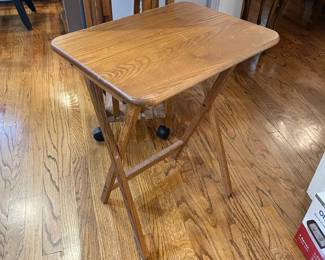 W119 - $50. Folding TV Tables (3) and drop leaf stand on wheels. Water marks on table top (pictured)