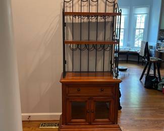 W130 - $100. Bakers Rack with storage for wine bottles & glasses. Measures 29" wide x 17" deep x 72" tall.