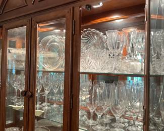 W9 - $250. Alexander Julian Lighted China Cabinet. Measures 61" wide x 18" deep x 85" tall. (Base is 32.5" Top is 53" tall) Has 2 glass shelves. Overall very good condition but does have minor signs of wear. Moves in two pieces.