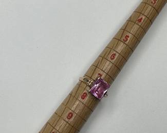 J9 - $225. Size 7.5 Ladies 10kt gold ring with large pink stone.