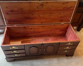 W69 - $50. Vintage Lane Cedar Chest with Key and padded seat. Measures 49" long x 18" deep x 21.5" tall. One bottom corner has chew damage - otherwise good vintage condition.