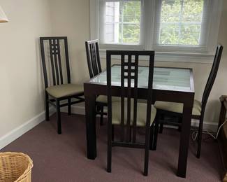 W88 - $80. Breakfast table and 4 chairs. Wood/glass. Table measures 35.5"wide x 35.5" deep x 29" tall. Chairs measure 18" wide x 18" deep x 41" tall.