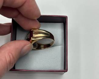J12 - $400. Size 11 Mens 10kt gold ring. Large red stone with inset diamond.