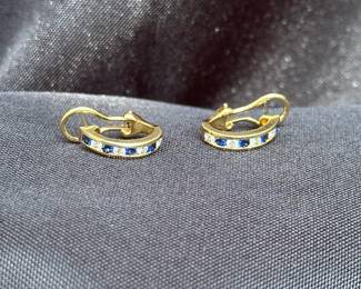 J36 - $1,750. Tiffany & Co. 750. 18kt gold, Diamond & Sapphire Huggie earrings with Omega back. When on has a .75" drop. In excellent condition!
