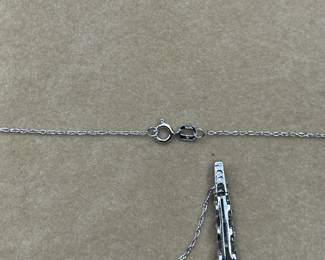 J21 - $120. 10kt white gold chain (17") & 1" Pendant with 2 small diamonds & light blue stones.