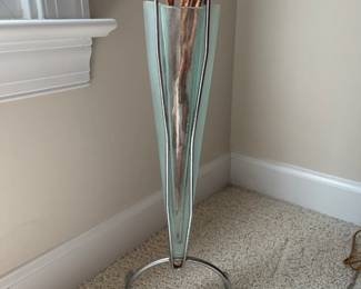 W13 - $25. Decorative Glass Vase on Stand. Measures 24" from floor to top of vase. Tag Reads - "Round The House. Made in America".