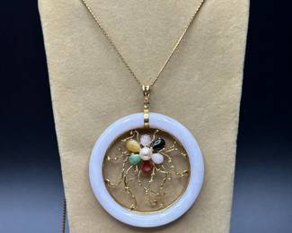 J20 - $500. 14kt gold necklace and White Jade & 14kt Pendant. Chain is 21" long. Pendant is 2.25" across. With gemstones & pearl in a flower pattern.