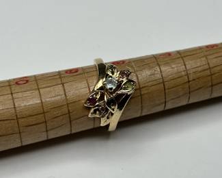 J6 - $300. Size 8.5. 14 kt gold ring with small gemstones (missing 1)