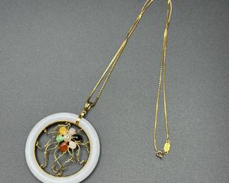 J20 - $500. 14kt gold necklace and White Jade & 14kt Pendant. Chain is 21" long. Pendant is 2.25" across. With gemstones & pearl in a flower pattern.