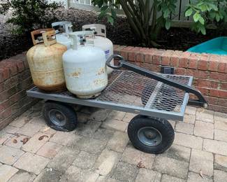 W122 - $10 each empty propane tanks. W123 - $50. Garden Cart - no sides!