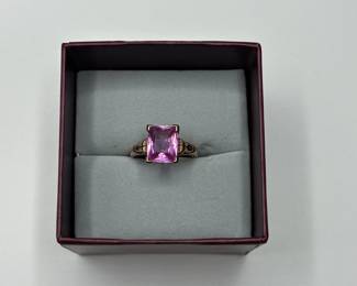 J9 - $225. Size 7.5 Ladies 10kt gold ring with large pink stone.