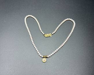 J37 - $1,500. Mikimoto Pearls. Authenticated. 17.5" long necklace. 18kt gold clasp and pendant. Pearls are 4-4.5mm. 