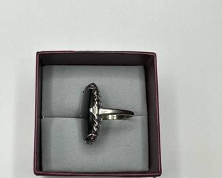 J10 - $240. Size 7. 10kt gold ring with large black stone.