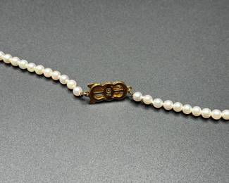 J37 - $1,500. Mikimoto Pearls. Authenticated. 17.5" long necklace. 18kt gold clasp and pendant. Pearls are 4-4.5mm. 