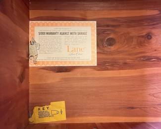 W69 - $50. Vintage Lane Cedar Chest with Key and padded seat. Measures 49" long x 18" deep x 21.5" tall. One bottom corner has chew damage - otherwise good vintage condition.