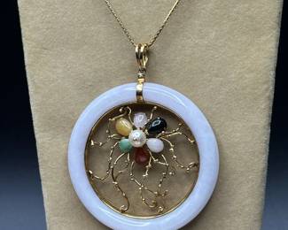 J20 - $500. 14kt gold necklace and White Jade & 14kt Pendant. Chain is 21" long. Pendant is 2.25" across. With gemstones & pearl in a flower pattern.