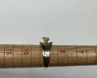 J13 - $400. Size 9. Ladies 14 kt gold ring with center diamond.