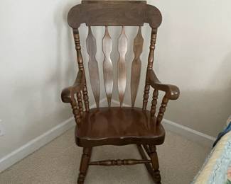 W27 - $85. Large Solid Wood Rocking Chair. Measures 22" wide x 32" deep x 46" tall. Cushions are clean!