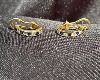 J36 - $1,750. Tiffany & Co. 750. 18kt gold, Diamond & Sapphire Huggie earrings with Omega back. When on has a .75" drop. In excellent condition!