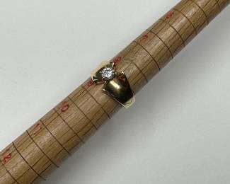 J13 - $400. Size 9. Ladies 14 kt gold ring with center diamond.