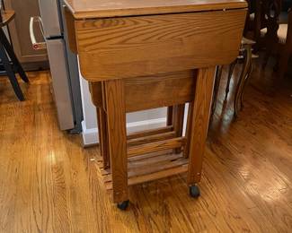 W119 - $50. Folding TV Tables (3) and drop leaf stand on wheels. Water marks on table top (pictured)