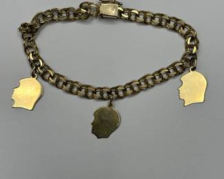 J17 - $450. 7" Charm Bracelet 10kt gold. Charms are engraved.