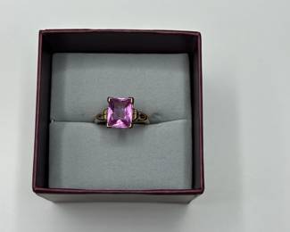 J9 - $225. Size 7.5 Ladies 10kt gold ring with large pink stone.