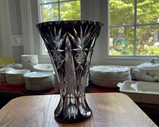 W128 - $35. Cranberry cut to clear crystal vase. Measures 8.25" tall.