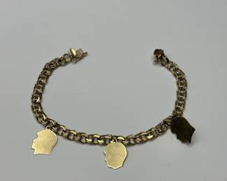J17 - $450. 7" Charm Bracelet 10kt gold. Charms are engraved.
