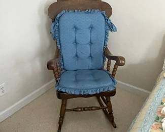 W27 - $85. Large Solid Wood Rocking Chair. Measures 22" wide x 32" deep x 46" tall. Cushions are clean!