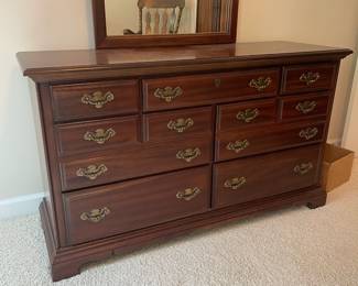 W31 - $175. American Drew 7 Drawer Dresser with Mirror. Measures 56" wide x 19" deep x 32" tall. Mirror is 30" wide x 43" tall.