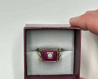 J12 - $400. Size 11 Mens 10kt gold ring. Large red stone with inset diamond.
