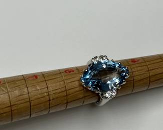 J3 - $500. Size 5.5. 14kt gold. (Aquamarine or Blue Topaz Stone.) Missing one small diamond.